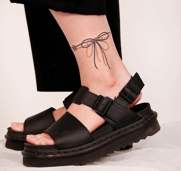 Ribbon ankle tattoo