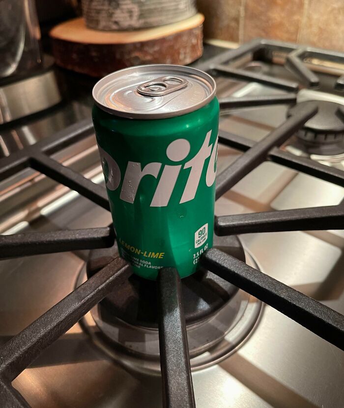 Mini Sprite Can In The Grates Of Our Stovetop