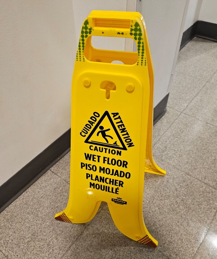 This Wet Floor Sign That Is Shaped Like A Banana