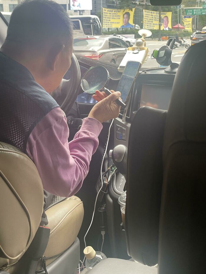 My Lyft Driver In Seoul Using A Magnifying Glass To See Directions On His Phone