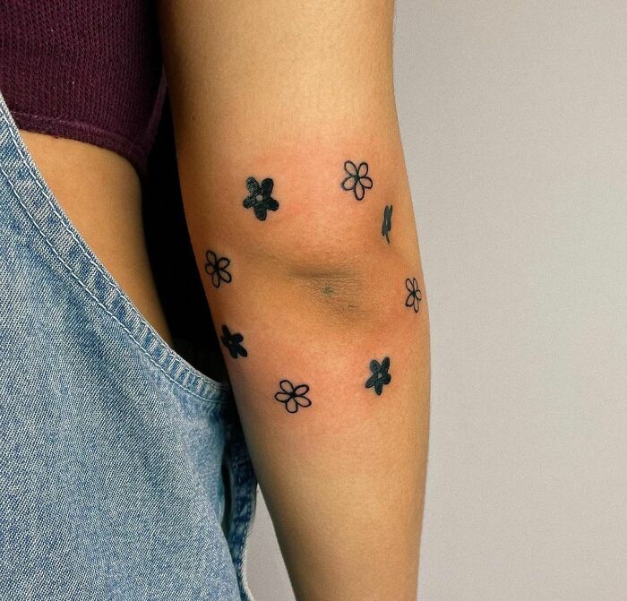 Flowers tatto around the elbow