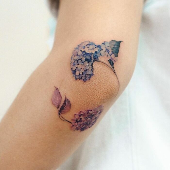 Hydrangea flowers tattoo around the elbow