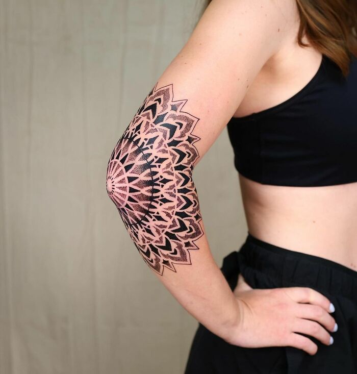 Mandala elbow tattoo
