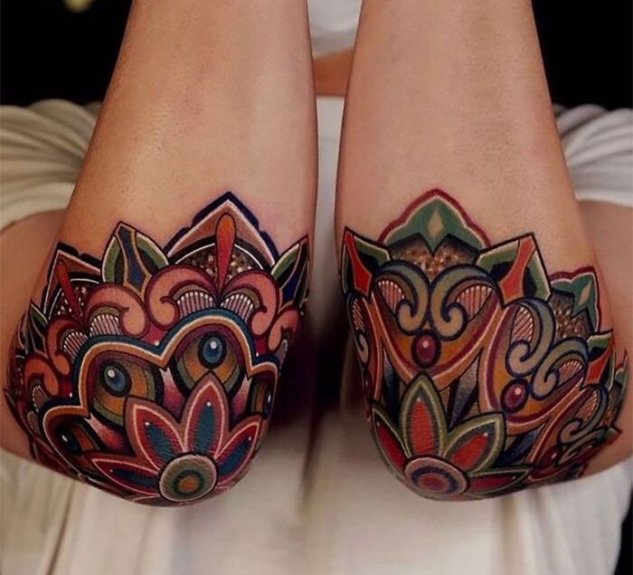 Watercolor mandala elbow tattoo