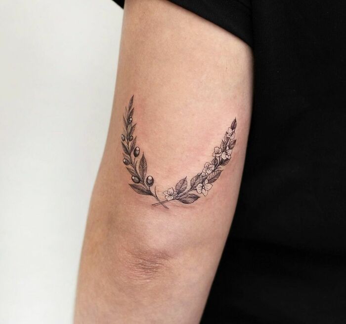 Olive and hydrangea branches elbow tattoo