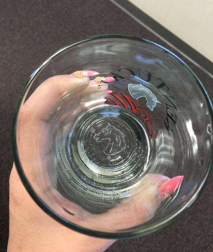 This Glass Is Made So The Little Bubbles In Your Drink Form The Brand's Logo