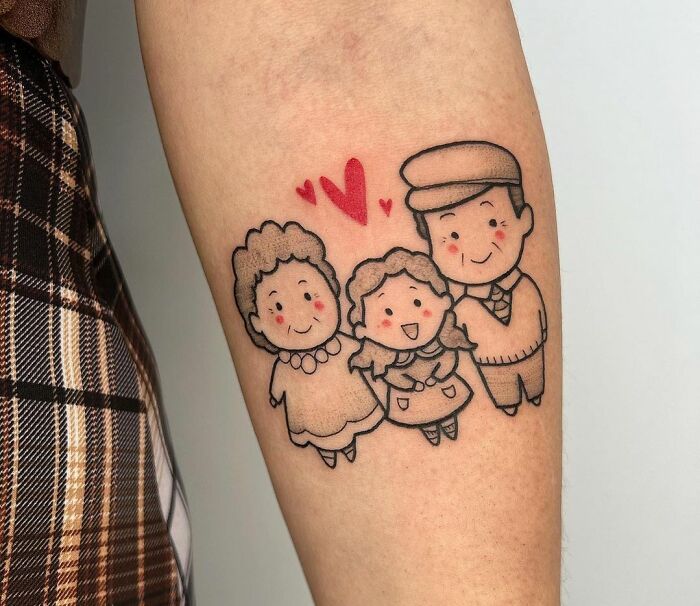 Cute animated grandparents and granddaughter forearm tattoo