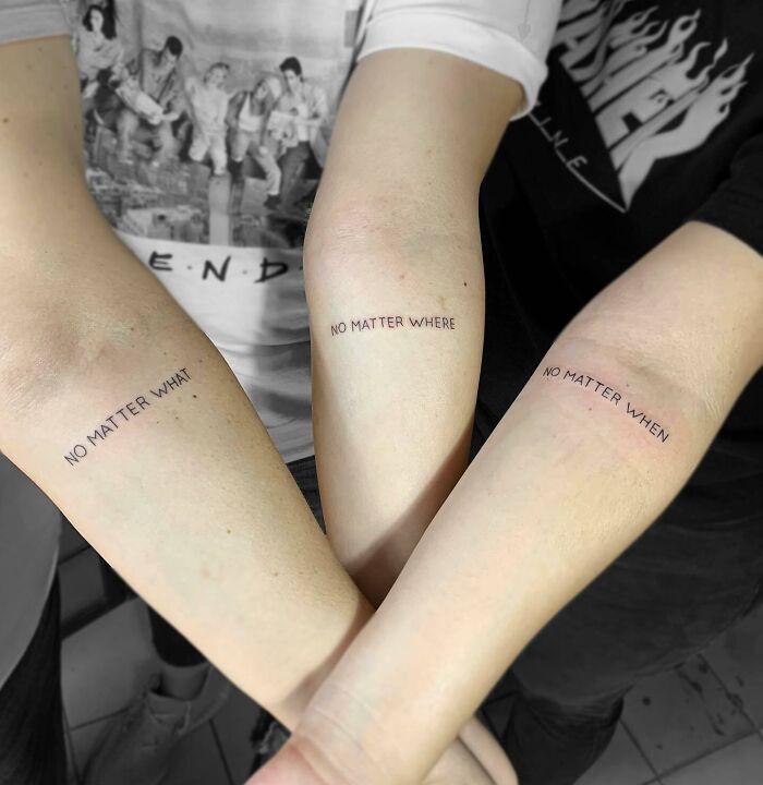 Matching family quote arm tattoo