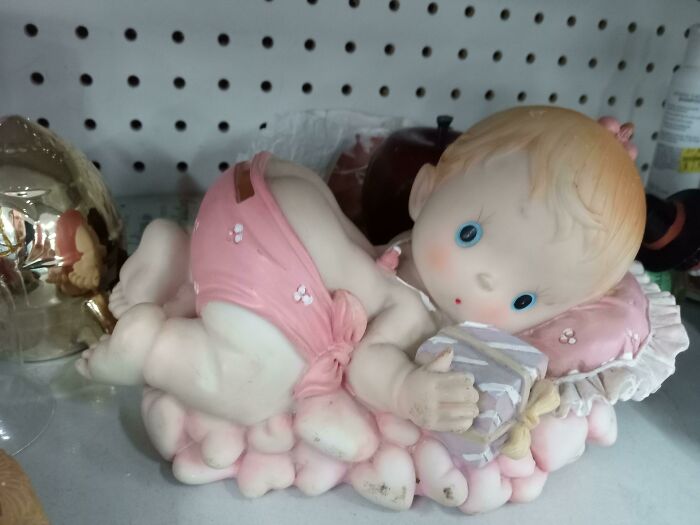 Found This In Good Will. It's A Piggy Bank Where You Put Coins Up A Baby's Butt While It's Giving You A Shocked Pikachu Face