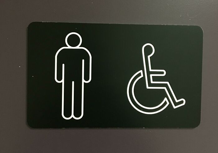 The Man On The Washroom Sign Has One Armpit That Is Higher Than The Other