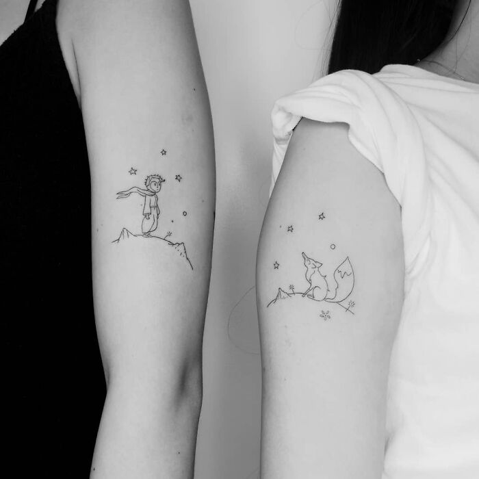 Matching mother and daughter prince and fox arm tattoos