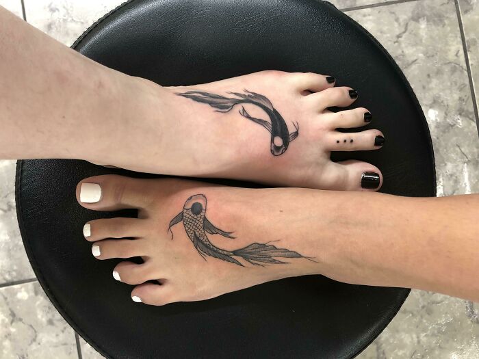 Swimming fishes foot tattoos