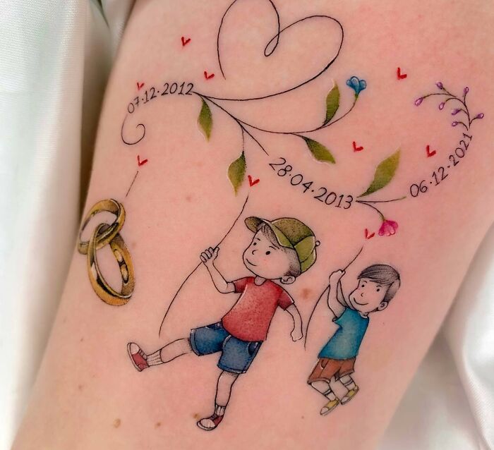 Children and dates arm tattoo