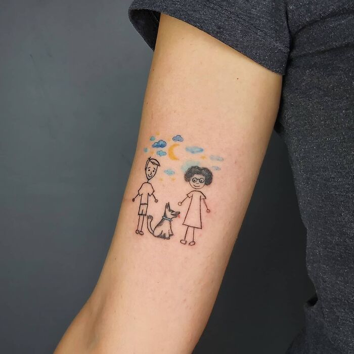 Father and mother with dog arm tattoo
