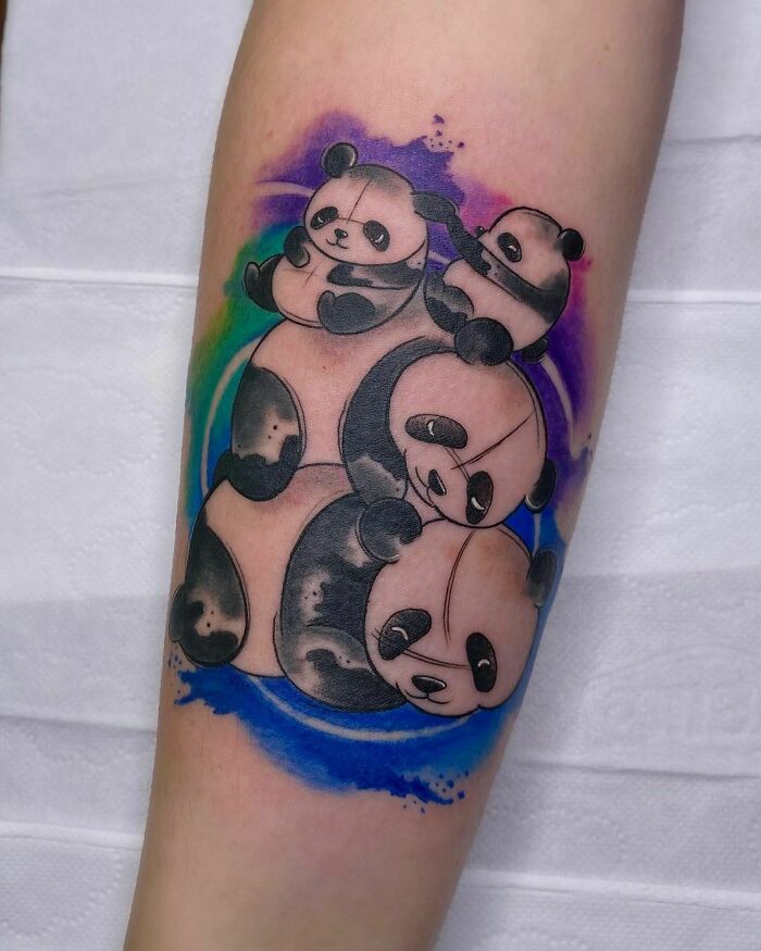 Colorful panda family arm tattoo