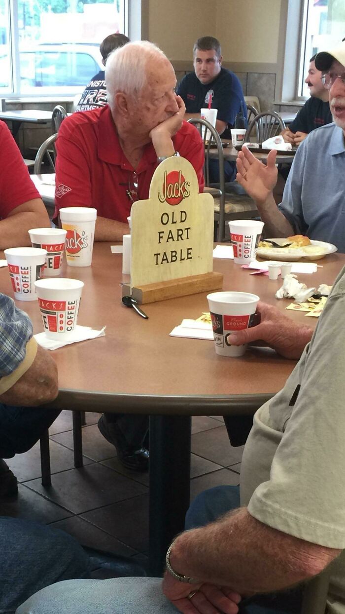 These Guys Sit At This Table Every Morning. The Restaurant Owners Made This Sign To Claim The Table For Them