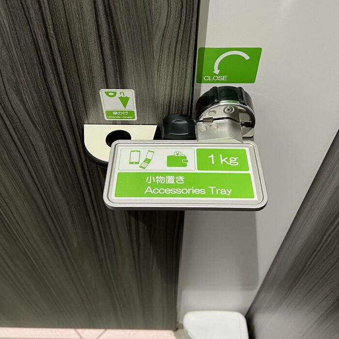 Door Latch That Doubles As An Accessories Holder At A Public Restroom In Japan. Simple Concept, Straightforward Design, Elegant Execution