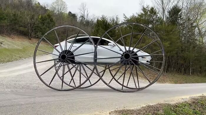 Tesla Model 3 With 10-Foot Wagon Wheels
