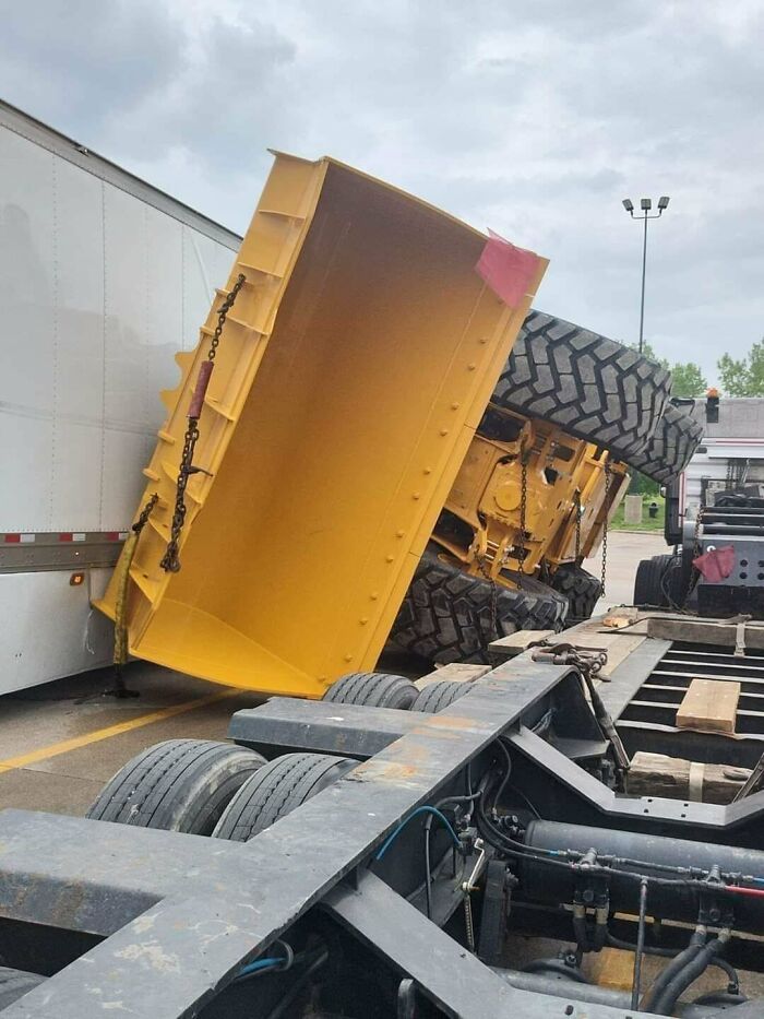Heard That The Driver Tried Shifting The Loader But Ran Up The Nose Of The Trailer And Tipped