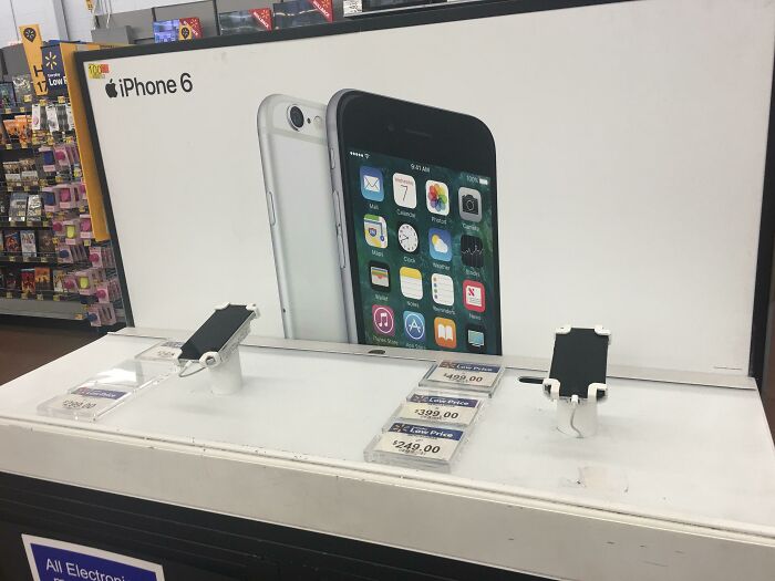 iPhone 14 Is Out & This Walmart Still Has The iPhone 6 Poster Up From 8 Years Ago