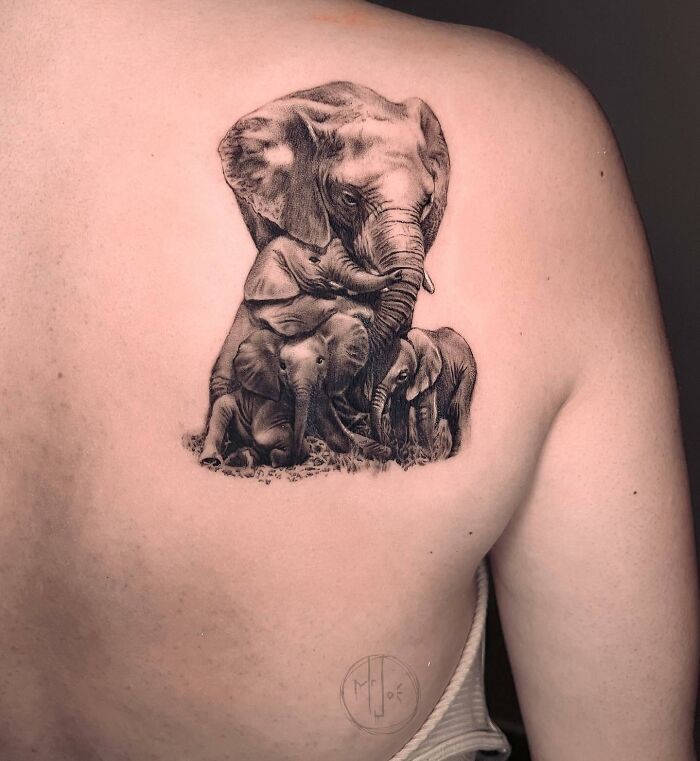 elephant family back shoulder tattoo
