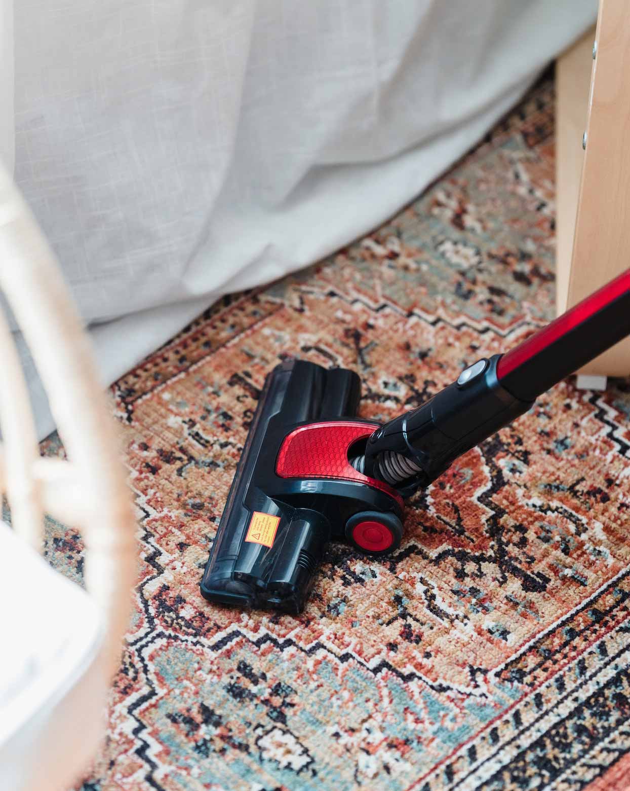 A vacuum cleaner on the carpet