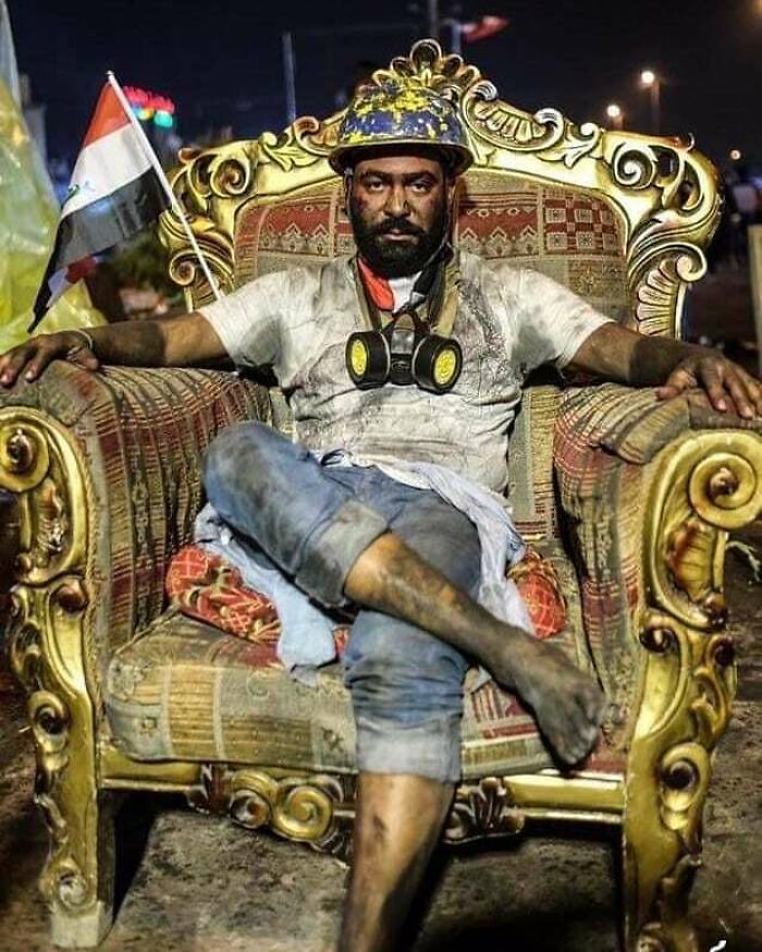 Iraqi Protestor Sits On The Chairs Of The Elected Officials That Have Failed Them. 2019