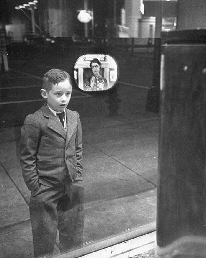 Boy Watching A TV For The First Time In A Store Window. 1948
