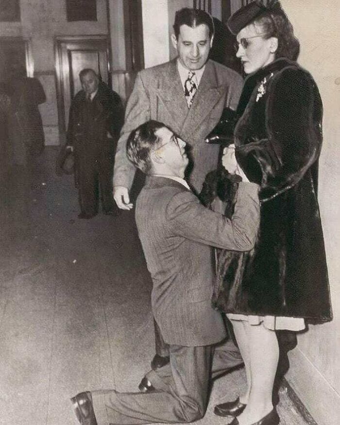 A Man Begging For His Wife's Forgiveness At Divorce Court In Chicago. 1948