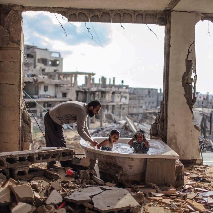 Father Bathes His Daughter And Niece In Their Bombed Home In Gaza. 2015 By @emadsnassar