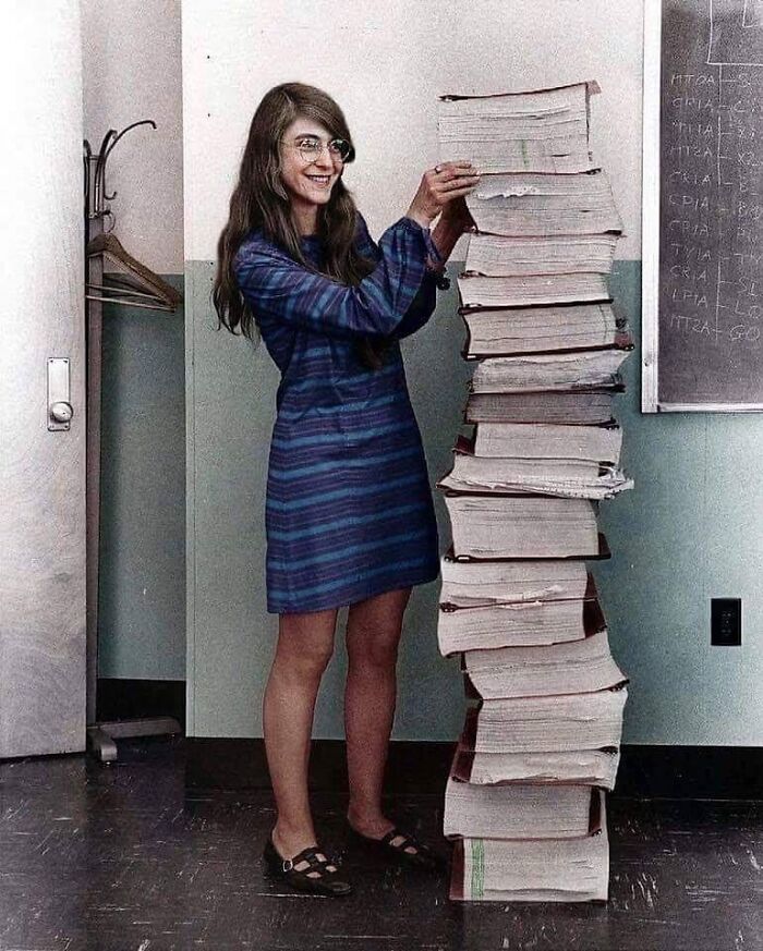 Margeret Hamilton, Lead Software Engineer Of The Apollo Project, Standing Next To The Code She Wrote By Hand That Helped Take Us To The Moon. 1969