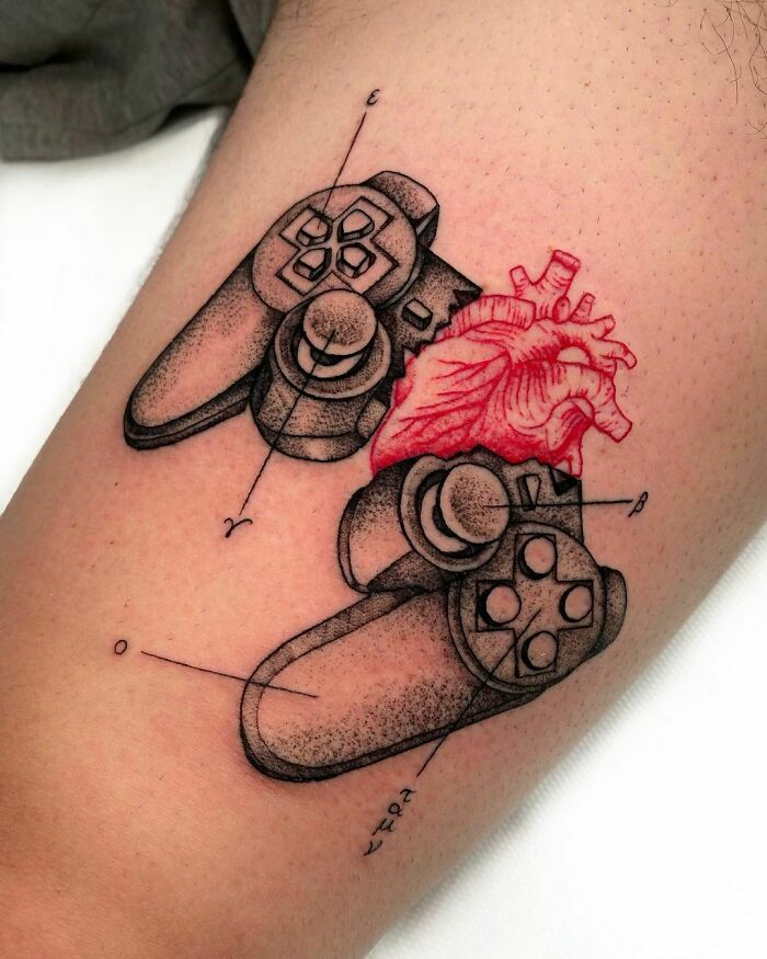 Gamepad with heart in between tattoo 