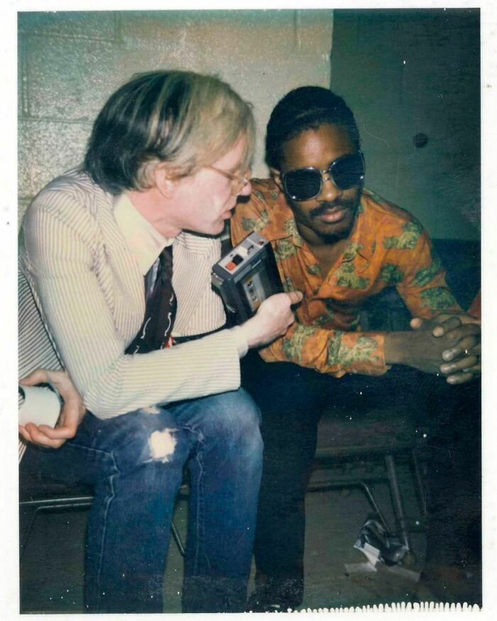 Andy Warhol, Stevie Wonder And Gil Scott-Heron Backstage After A Rolling Stones Concert At Madison Square Garden In New York City, July 1972