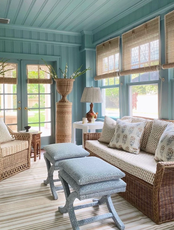 WIcker Material Furniture In A Cozy Blue Sunroom