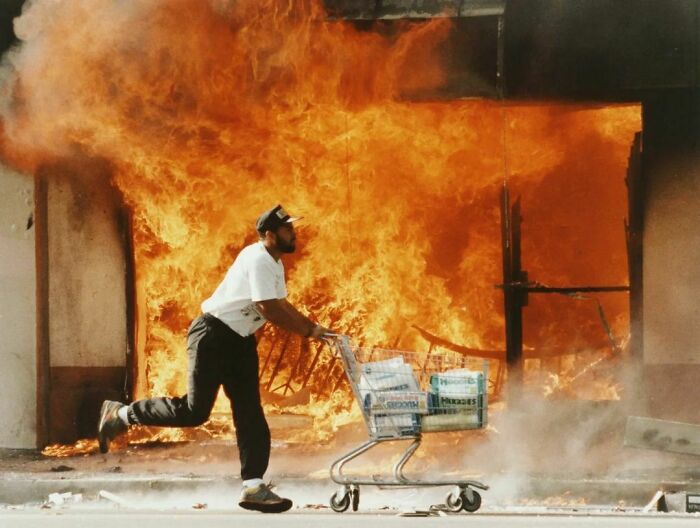 A Man Rushes Off With A Trolley Full Of Diapers During The 1992 Los Angeles Riots. Photograph By Kirk Mckoy