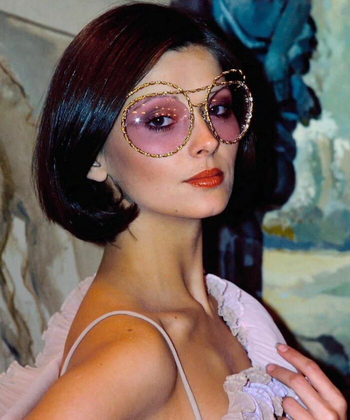 Model Wearing Award Winning Glasses, 19 November, 1974. The Braided Gold Frame With Mauve Lenses, Dotted With Stardust, Won Top Prize In Fashion Eyewear Group Of America's 10th Annual Design Awards