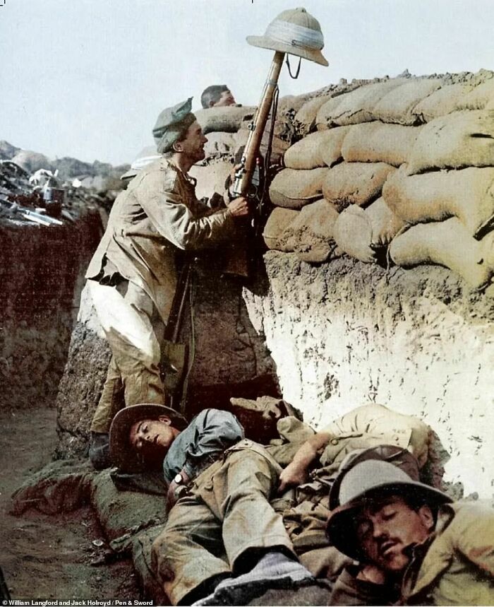 A British Soldier Is Seen Tempting Turkish Snipers To Give Away Their Positions While Others Snatch Some Shut-Eye During The Gallipoli Campaign In 1915, World War I