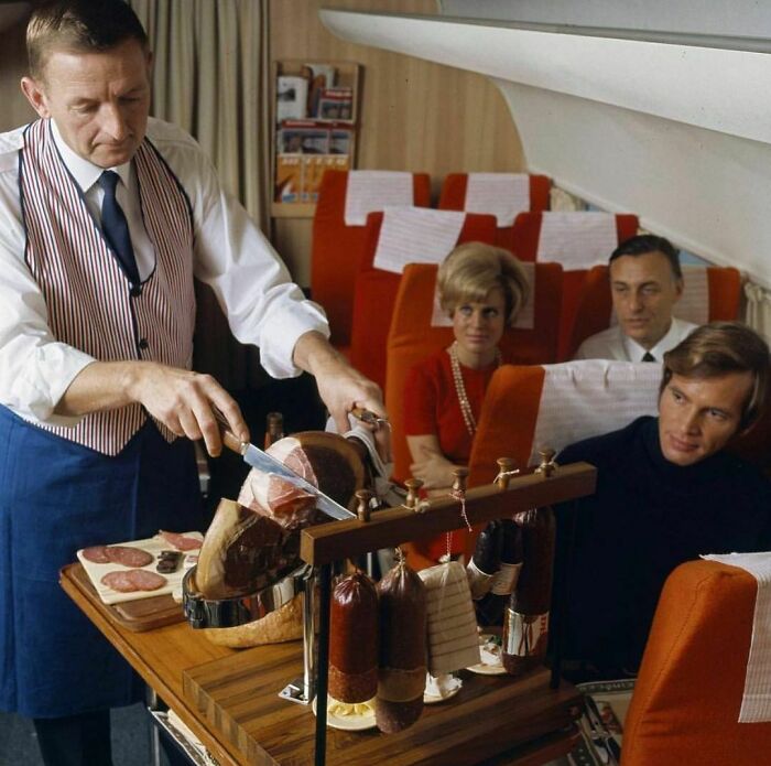 A Steward Slices Meat For Passengers On Sas Scandinavian Airlines, 1969