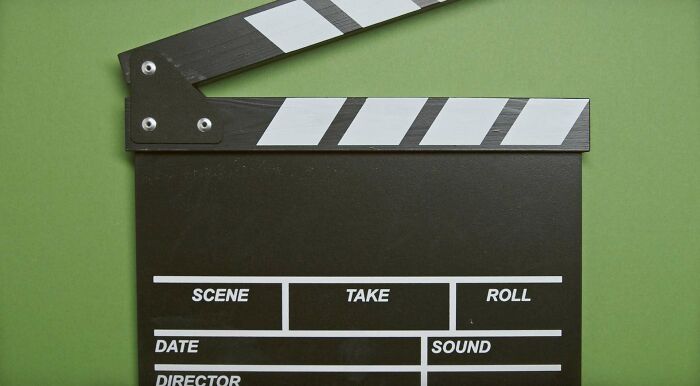 Clapper board on a green background