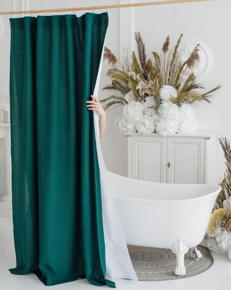 Dark green clawfoot tub shower curtain.