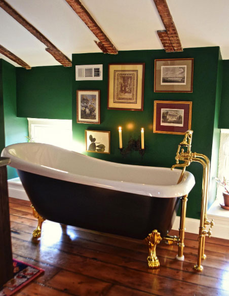 Slipper clawfoot tub in the green-wall room.