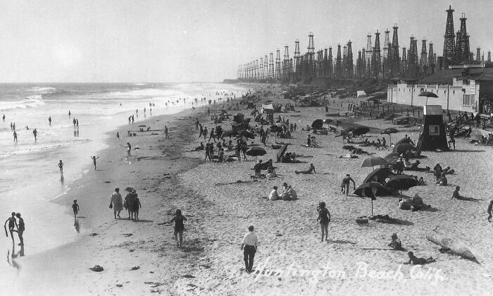 Oil Derricks And Beach-Goers At The Huntington Beach, California, 1930's
