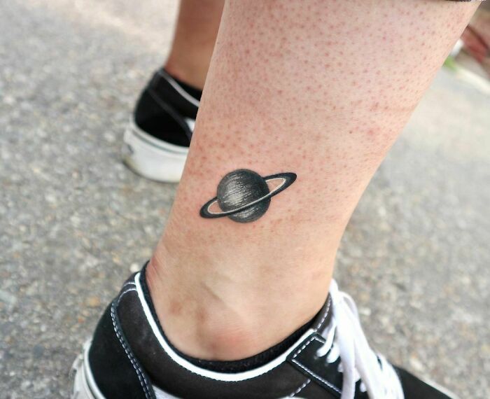 Planet ankle tattoo
