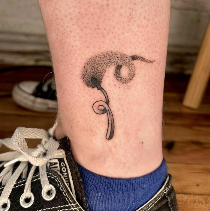Burning match ankle tattoo