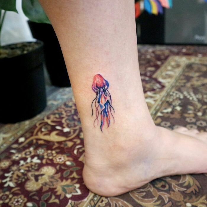Watercolor jellyfish ankle tattoo