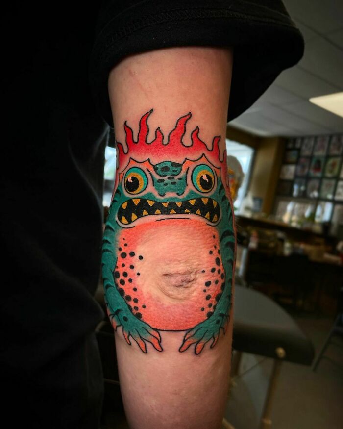 Watercolor frog elbow tattoo