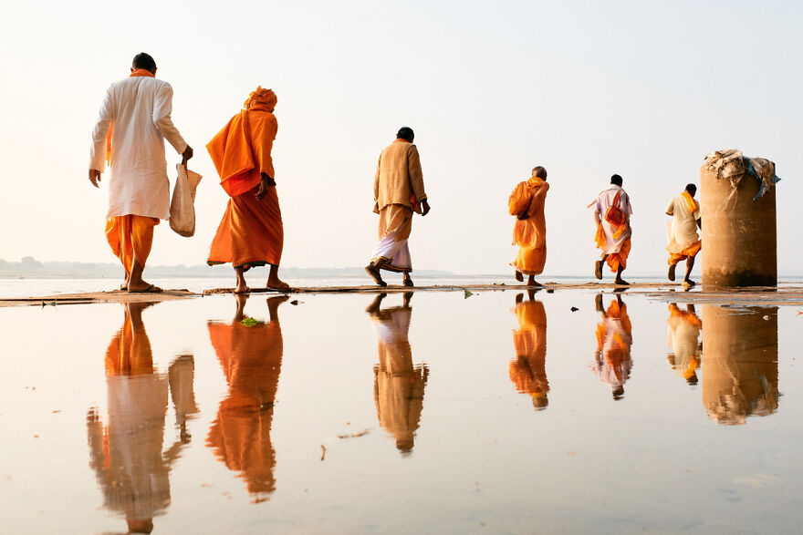 Reflection of pilgrims, seemingly walking on the horizon