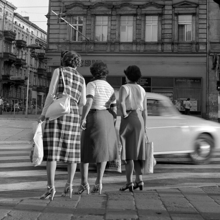 A picture of three women crossing the street