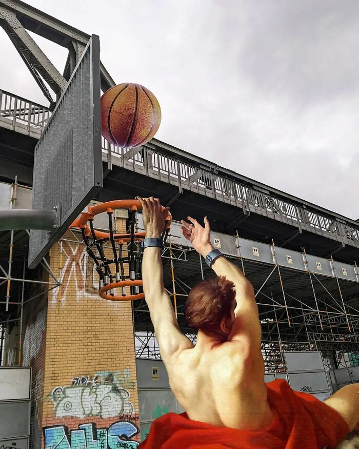 An image of a man from "Prometheus Freed By Hercules" playing basketball
