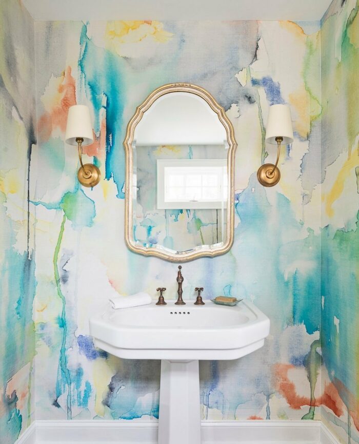 Bathroom with watercolor wallpaper and white sink